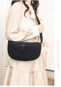 Casual nylon crescent crossbody bag for daily use, lightweight waterproof saddle bag style.