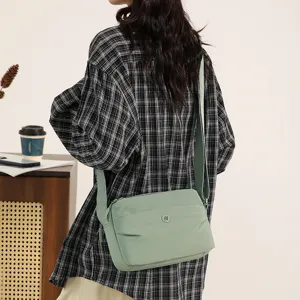 Light green nylon crossbody shoulder bag for women, minimalist casual daily travel purse.