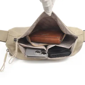 Close-up view of the spacious inner compartment showing multi-pocket design and large storage capacity.