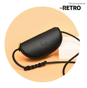 Genuine leather crescent crossbody bag for women, stylish minimalist half-moon shoulder bag with chic knotted strap design.