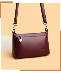 Sac à bandoulière en cuir souple bordeaux pour femme, sac porté épaule élégant et pratique.