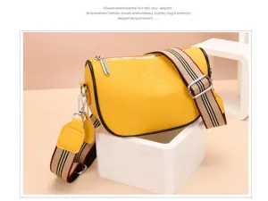 Borsa a tracolla in pelle gialla da donna, elegante borsetta con larga cinghia a righe.