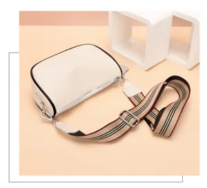 Borsa a tracolla minimalista da donna in vera pelle con comoda e chic tracolla a righe.