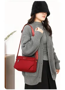 Casual women nylon crossbody bag detail, stylish red shoulder bag for daily travel use.
