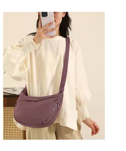 Detailed view of women nylon crossbody bag, large capacity travel hobo shoulder dumpling bag.