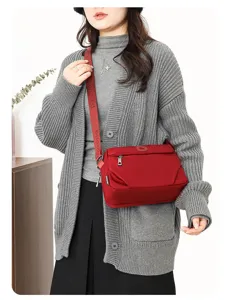 Detailed view of women's casual waterproof nylon crossbody shoulder bag for daily use.