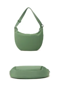 Close-up detail view of the lightweight nylon crescent shoulder bag showcasing durable fabric.