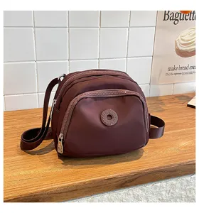 Lightweight nylon crossbody bag casual multi-pocket shoulder shell bag for daily commute.
