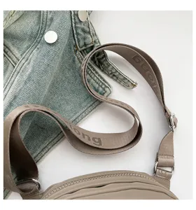 Lightweight nylon crossbody bag adjustable shoulder strap casual commute shell bag daily use.
