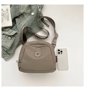Casual nylon crossbody shell bag, lightweight daily shoulder bag with adjustable strap and zip.
