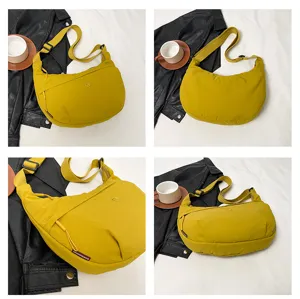 Casual yellow nylon cross body bag, lightweight waterproof crescent shoulder bag for women