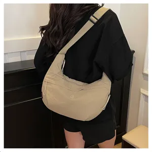 Minimalist nylon hobo crossbody bag for women, lightweight waterproof casual shoulder bag daily.