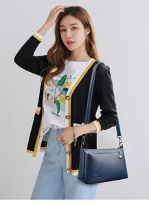 Sac à bandoulière élégant en cuir souple pour femme, sac porté épaule uni de qualité.
