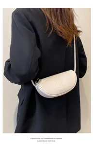 Detailed view of the stylish white leather crescent shoulder bag, perfect for daily casual wear.