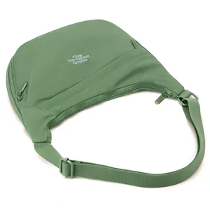 Green nylon crossbody bag for women, large capacity shoulder bag for travel and daily use.