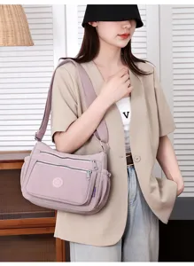 Multi-pocket nylon crossbody shoulder bag for women, casual mauve purple daily shoulder bag.