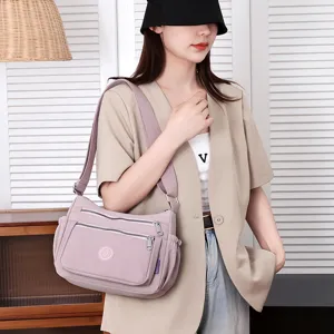 Stylish nylon crossbody bag with multi-pocket design, lightweight shoulder bag for women.