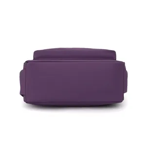 Purple nylon bag bottom detail view, durable fabric material, sleek design for daily wear.