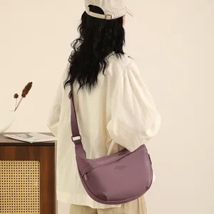 Nylon crossbody dumpling bag detail view, casual lightweight shoulder bag for travel daily use.