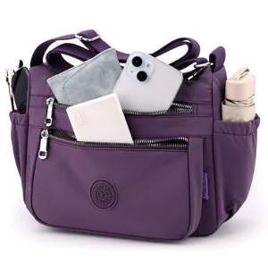 Purple nylon crossbody bag with multiple zipped compartments, casual shoulder bag for women.