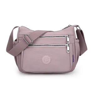 Casual nylon crossbody shoulder bag for women, multi-pocket travel handbag with strap.