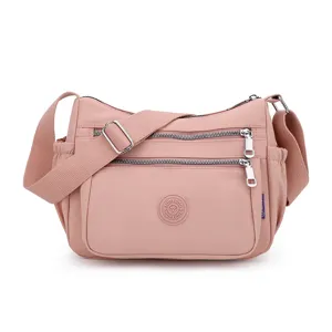 Pink nylon crossbody shoulder bag with multi zippers for women daily travel casual use