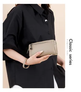 Genuine leather wristlet clutch wallet for women, compact phone bag with double zippers.