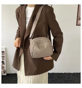 Casual lightweight nylon crossbody bag for women, stylish daily commute shell shoulder bag detail.