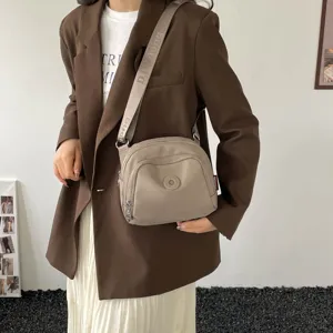 Casual nylon crossbody bag for women, lightweight commuter shoulder shell bag with strap.