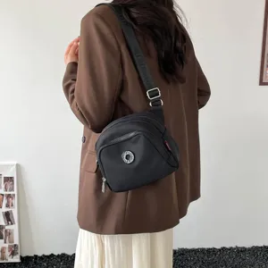 Casual nylon crossbody shoulder bag for women, lightweight fashion commuter shell bag style daily.