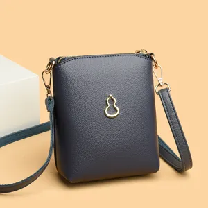 Dark blue leather crossbody phone bag with gold metal gourd charm, elegant main product view.