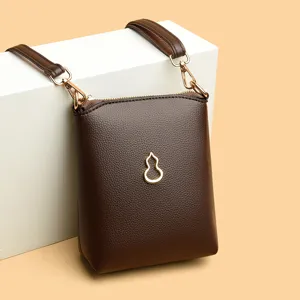 Korean style brown leather crossbody phone bag with gold gourd pendant main product view.