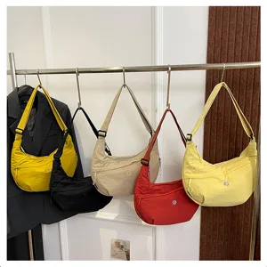 Nylon crescent crossbody bag details showing lightweight waterproof shoulder bag design.