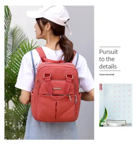 Casual women backpack detail showing USB port, large capacity, and durable nylon fabric material.