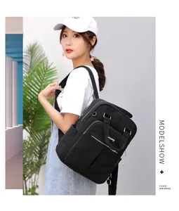 Detailed view of black casual backpack with front pocket, multi-compartment design.