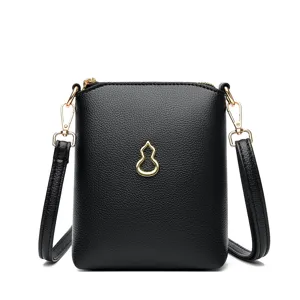 Black leather mini crossbody phone bag with gold hulu charm and detachable strap.