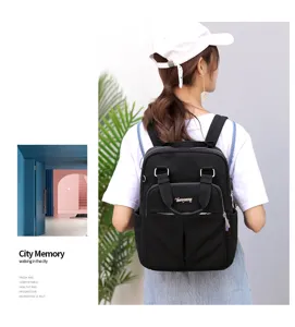 Detailed view of black travel backpack with USB charging port and spacious compartments.