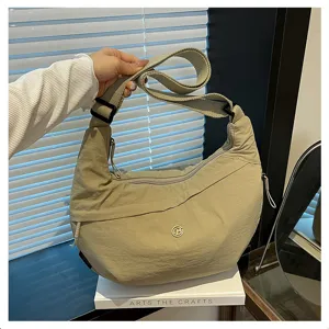 Lightweight nylon crescent crossbody bag, casual waterproof shoulder bag for women daily use.