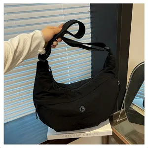 Minimalist black waterproof nylon crossbody bag, lightweight large capacity hobo shoulder bag.