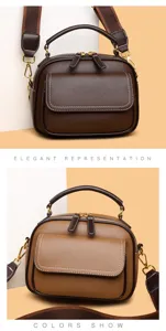 Detail view of stylish multi-layer women leather crossbody bag with top handle and strap.