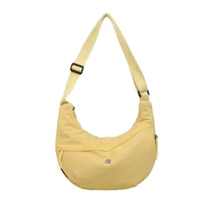 Lightweight waterproof nylon crescent crossbody shoulder bag for daily casual use.