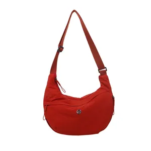 Discover this lightweight red nylon crescent crossbody bag, spacious waterproof shoulder bag.