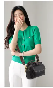 Detailed view of the multi-layer leather crossbody bag showing wide strap and hardware.