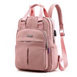 Pink casual women backpack with USB charging port, large capacity school and travel daypack.