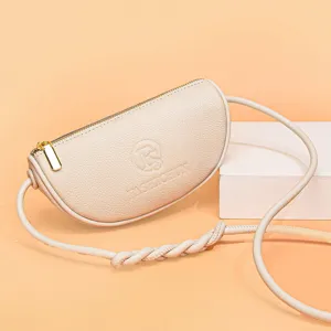 Minimalist half-moon genuine leather crossbody bag for women with stylish braided strap.