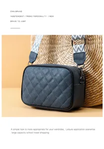 Stylish quilted leather crossbody bag, compact camera handbag with chic patterned wide strap for women.
