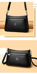 Detailed view of black PU leather women shoulder bag with zipper pocket and metal logo charm.