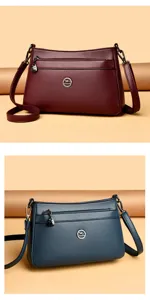 Detailed view of women leather shoulder bag with fine texture, metal hardware and multi pockets.