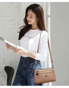 Brown leather shoulder bag for women, casual crossbody bag with zipper pockets, daily use.