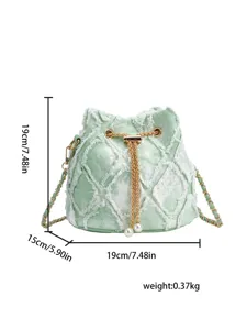 Green denim bucket bag with diamond embroidery, chain strap and pearl drawstring detail.
